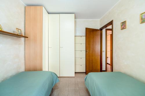 Postel nebo postele na pokoji v ubytování Casa delle Magnolie