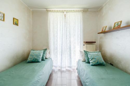 Postel nebo postele na pokoji v ubytování Casa delle Magnolie