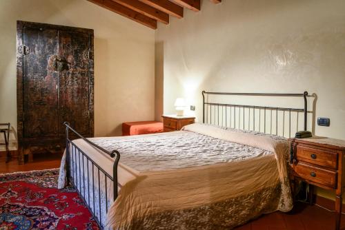 Ένα ή περισσότερα κρεβάτια σε δωμάτιο στο Residence ANTICO SAN ZENO centro storico