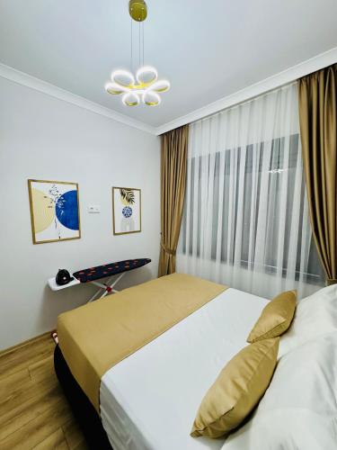 a bedroom with a large bed and a window at Sunny Shores Holiday in Alanya