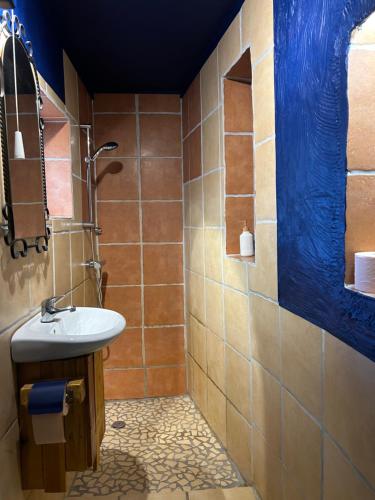 a bathroom with a sink and a shower at Lazy Days in Debrecen