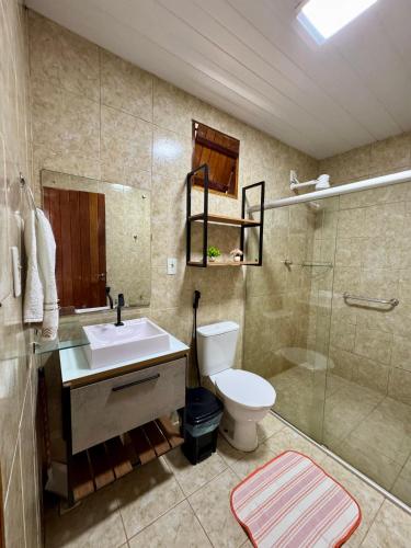 a bathroom with a sink and a toilet and a shower at Flat HOTEL Pedra do Rodeadouro 1 andar in Bonito