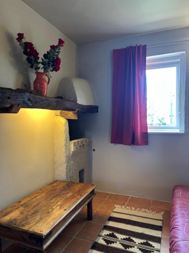 a living room with a bench and a window at Lazy Days in Debrecen