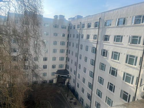 an external view of a large white building at Atlas Hostel in London