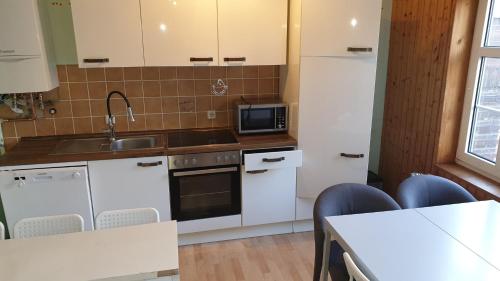 Η κουζίνα ή μικρή κουζίνα στο Ctiy Home Peine