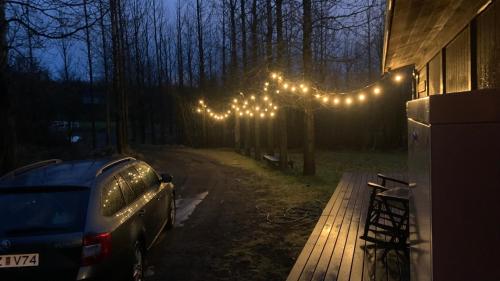 a car parked in front of a house with lights at Ásabyggð 1 Flúðir in Fludir
