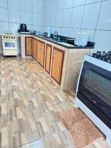 a kitchen with a stove and a counter top at Casa Clarice in Alto Caparao