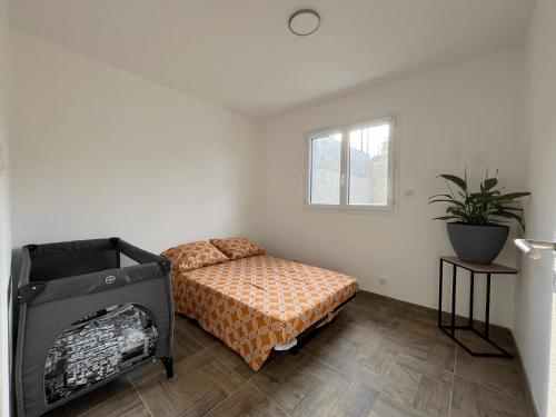 Postel nebo postele na pokoji v ubytování MAISON à Ajaccio tout CONFORT- proche plage et aéroport- Extérieur privatif avec barbecue