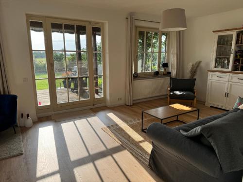 a living room with a couch and a table at Haus Seeglück am Prüßsee in Güster