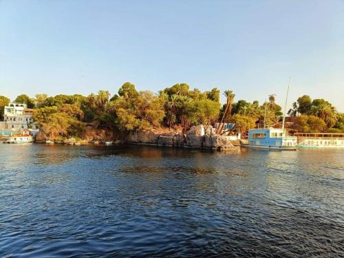 a body of water with boats in it at Samara Guest House in Aswan