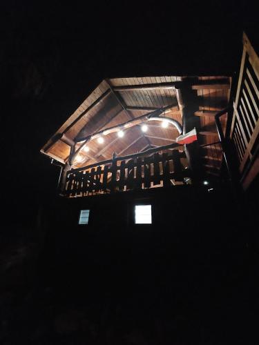 a room with a balcony with a wooden ceiling at Tresna Dream in Tresna