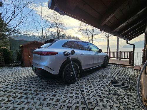 a white car is parked on a driveway at Tresna Dream in Tresna