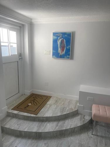 a room with a door and a painting on the wall at Jays Getaway in Perth