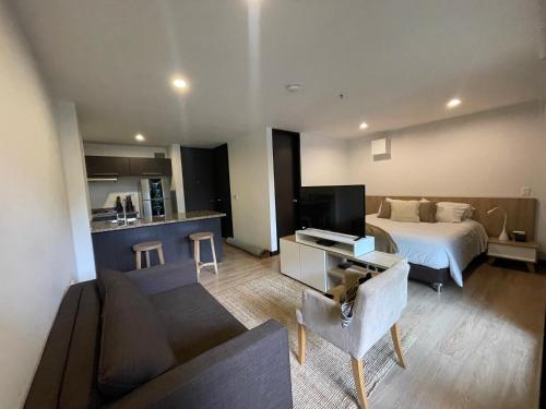 TV a/nebo společenská místnost v ubytování Suite Rioverde Hotel Rionegro