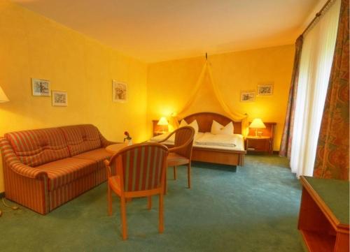 Postel nebo postele na pokoji v ubytování Meister BÄR HOTEL Vogtland