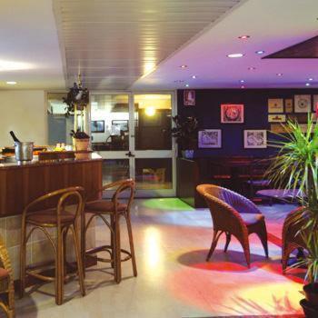 a restaurant with chairs and a table in a room at Hotel Centro Turistico Gardesano in Bussolengo