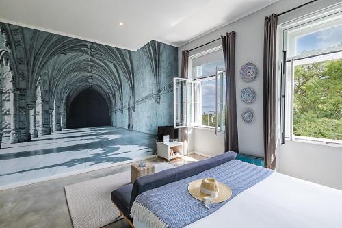 a living room with a bed and a tunnel at Emporium Lisbon Suites in Lisbon