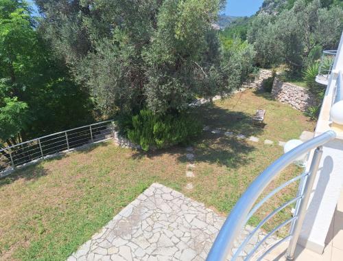 a view from a balcony of a yard with a tree at Vila Brca in Brca