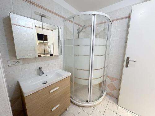 a bathroom with a shower and a sink at Direct Monaco Studio devant piscine in Beausoleil