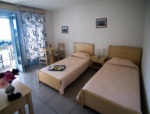Vuode tai vuoteita majoituspaikassa Aiolos Hotel Andros