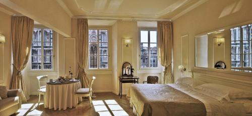 Katil atau katil-katil dalam bilik di Granduomo Charming Accomodation