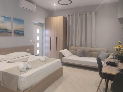 Postel nebo postele na pokoji v ubytování BP Beach Apartments