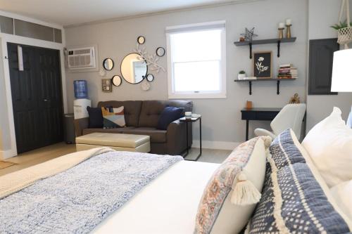 a living room with a bed and a couch at Studio 604 in Bloomington
