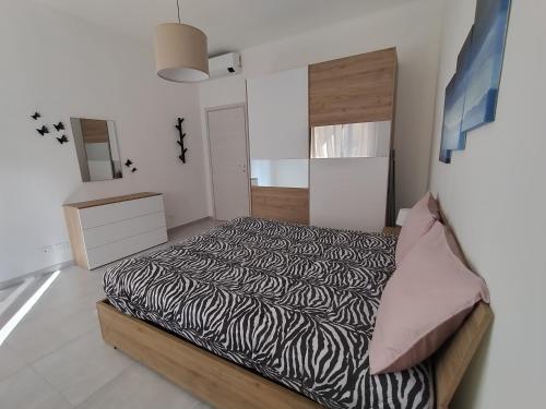 Ένα ή περισσότερα κρεβάτια σε δωμάτιο στο Casa Stefania