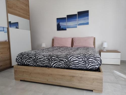 Ένα ή περισσότερα κρεβάτια σε δωμάτιο στο Casa Stefania