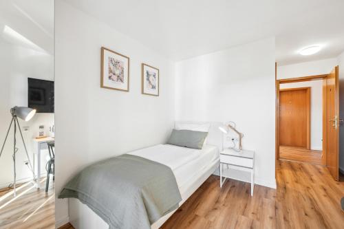 Postel nebo postele na pokoji v ubytování Gästehaus Hartwig