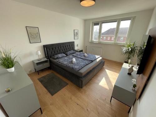 Giường trong phòng chung tại Modernes Apartment/Nähe Zentrum