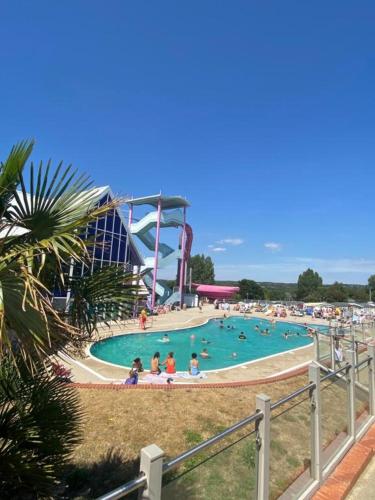 a group of people in a pool at a water park at Modern & Homley 3BR Caravan in Hastings