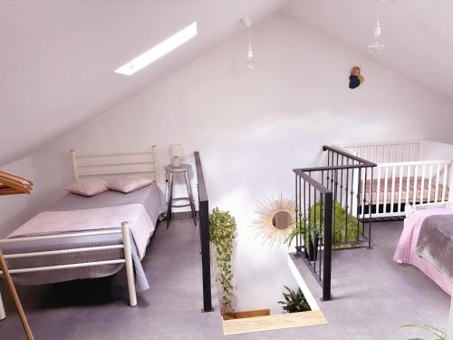 a bedroom with a bunk bed and a crib at Angela`s Loft in Ribeira Brava