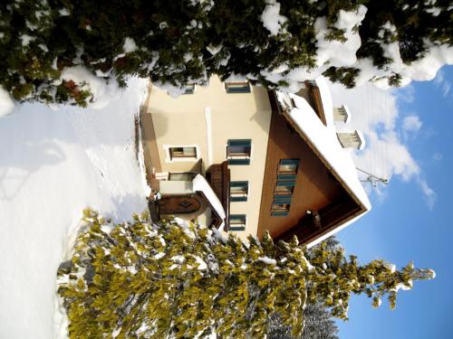 an aerial view of a building in the snow at Alpencamp Kärnten in Kötschach