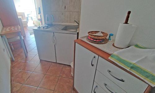 a kitchen with a sink and a counter top at Rooms Beba in Herceg-Novi
