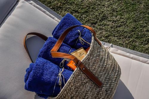 a blue bag sitting on top of a table at Carpos Villa in Aegina Town