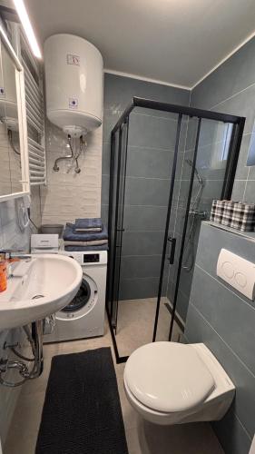 Koupelna v ubytování KukoriQ 1 Apartman