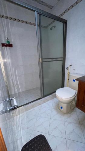 a bathroom with a shower and a toilet at Casa Castillo Cali in Cali