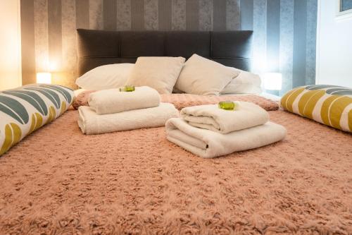 a room with a couch and pillows on a carpet at Apartments Villa Sol in Ston