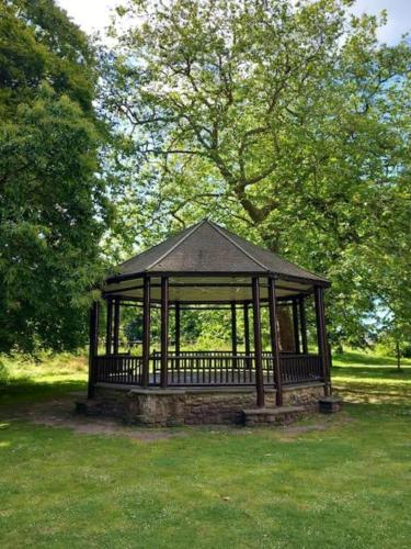 a gazebo in the middle of a park at Regis Lodge Guest House in Bognor Regis