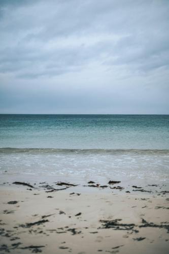 a view of the ocean from the beach at Arctic Apartments - Ramberg Beach in Ramberg