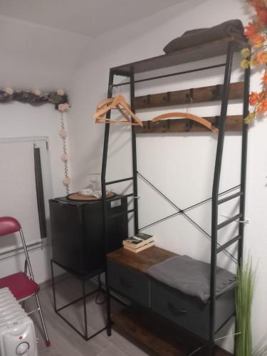 a black bunk bed with a dresser and a desk at Altstadt Oase Bernkastel-kues in Bernkastel-Kues