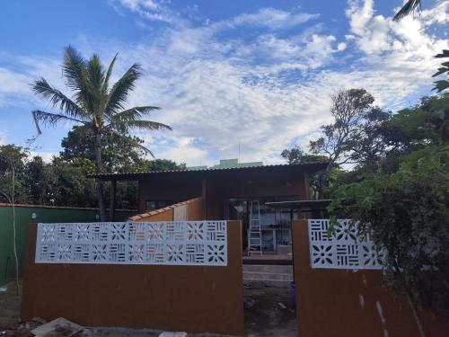 a house with a gate in front of it at Loft BeiraMar 2 in Serra