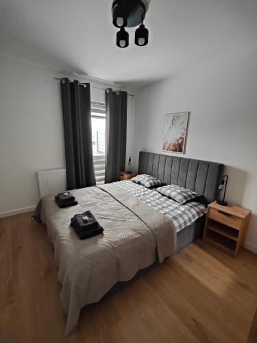 Ένα ή περισσότερα κρεβάτια σε δωμάτιο στο Apartament Jan