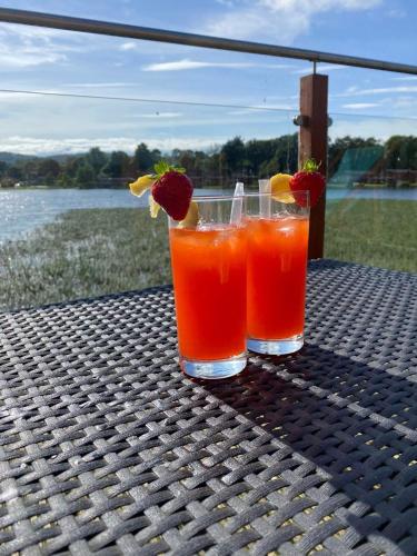 two cocktails sitting on top of a table at Gressingham 9 - South Lakes Leisure Village - lodge on the lake in Carnforth