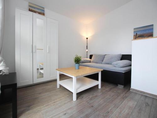 a living room with a couch and a table at Reihenhaus in Malchow in Malchow