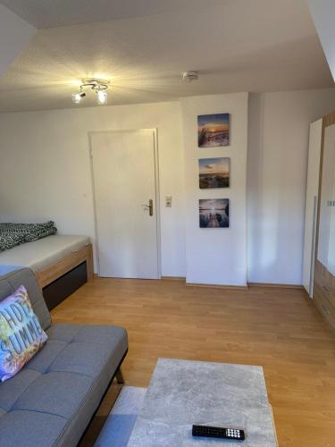 a living room with a couch and a door at Linda Ninh Apartment 6 Altstadt in Dresden