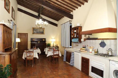 a kitchen with two tables and a dining room at Rovezzano B&B in Florence