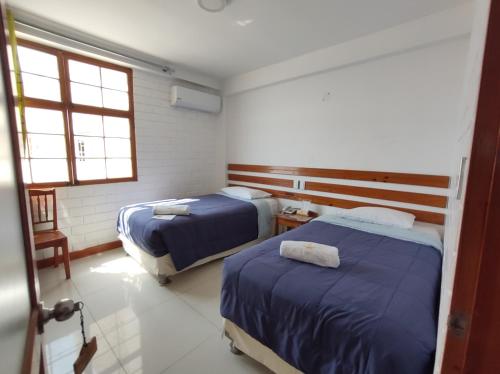 Letto o letti in una camera di La Estacion Gran Hotel
