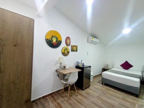 Ένα ή περισσότερα κρεβάτια σε δωμάτιο στο Aguacatala Hotel Boutique